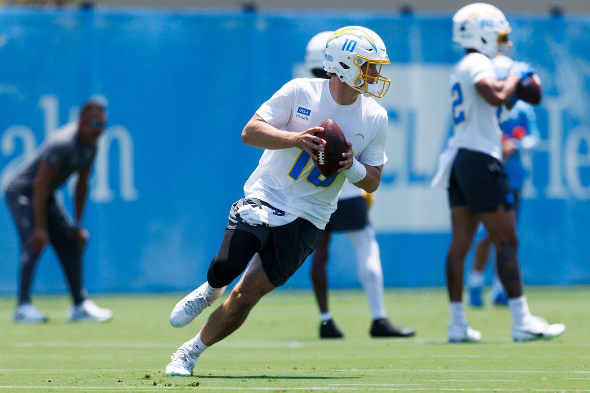 Justin Herbert #10 of the Los Angeles Chargers rolls out to pass during an OTA practice session at The Bolt on May 27, 2025 in El Segundo, California. Justin Herbert #10 of the Los Angeles Chargers rolls out to pass during an OTA practice session at The Bolt on May 27, 2025 in El Segundo, California.