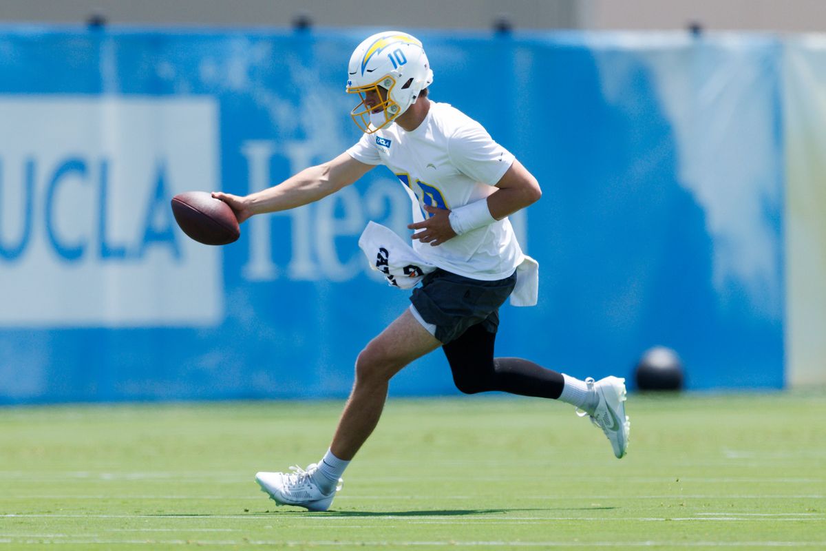 Justin Herbert #10 of the Los Angeles Chargers hands off the ball during an OTA practice session at The Bolt on May 27, 2025 in El Segundo, California. Justin Herbert #10 of the Los Angeles Chargers hands off the ball during an OTA practice session at The Bolt on May 27, 2025 in El Segundo, California.