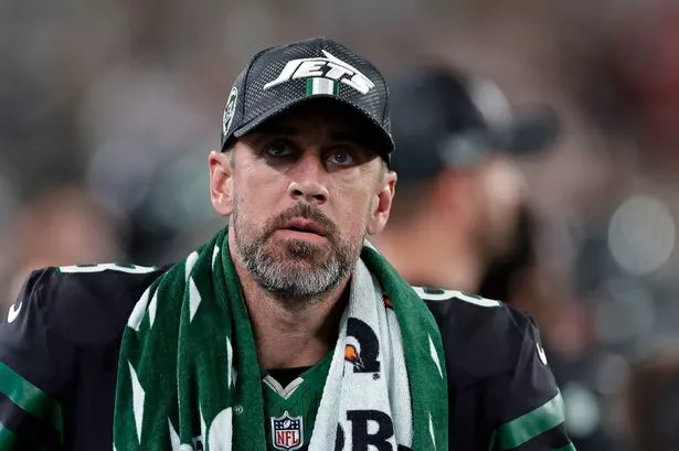 New York Jets quarterback Aaron Rodgers (8) looks on during an NFL football game against the Houston Texans Thursday, Oct. 31, 2024, in East Rutherford, N.J.