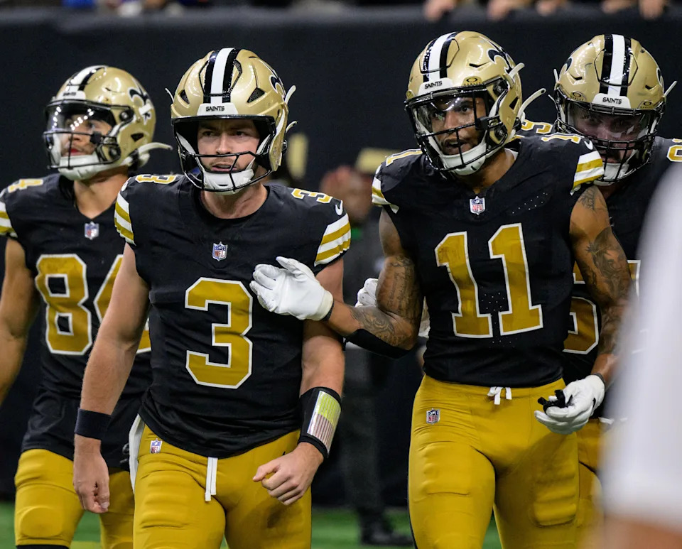 Oct 17, 2024; New Orleans, Louisiana, USA; New Orleans Saints wide receiver Cedrick Wilson Jr. (11) celebrates a touchdown late in the fourth quarter with New Orleans Saints quarterback Jake Haener (3) against the Denver Broncos at Caesars Superdome. Mandatory Credit: Matthew Hinton-Imagn Images