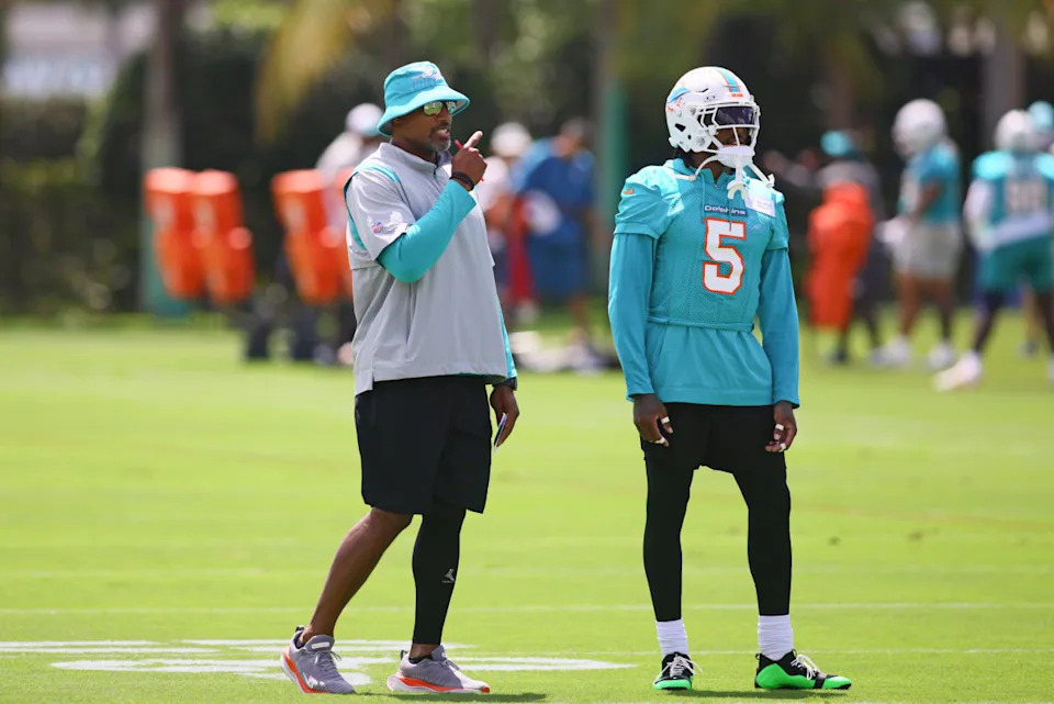 Miami Dolphins defensive coordinator Anthony Weaver talks to cornerback Jalen Ramsey (5) during mandatory minicamp at Baptist Health Training Complex.Sam Navarro-Imagn Images
