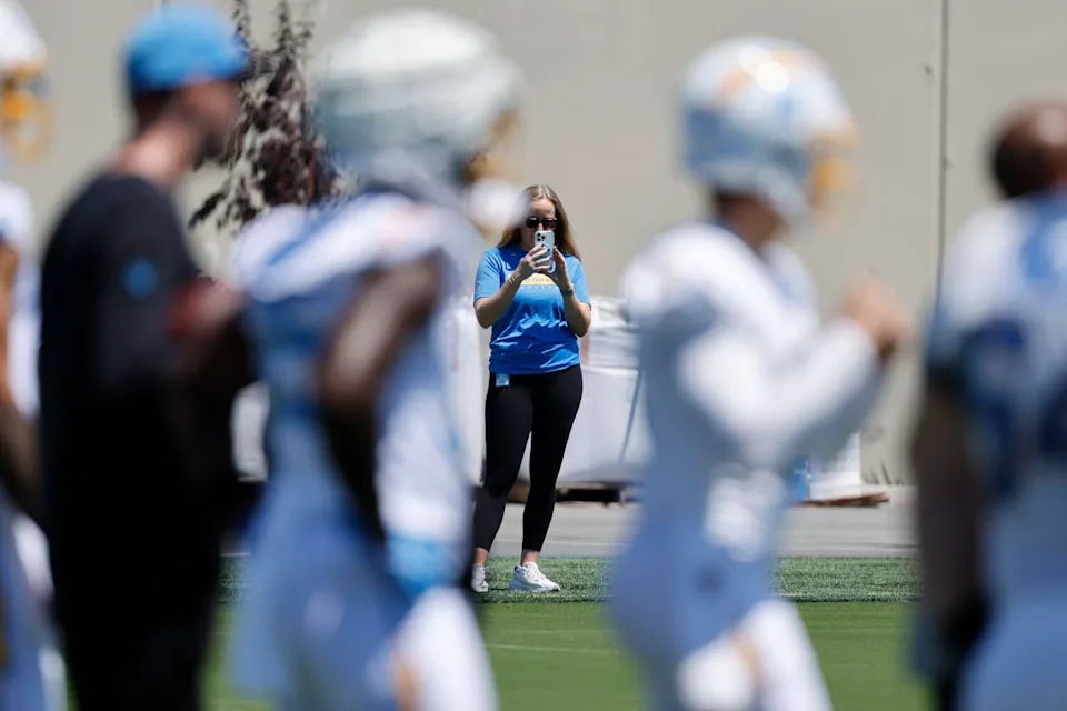 Allie Raymond records players and coaches taking part in Chargers rookie minicamp on May 9.