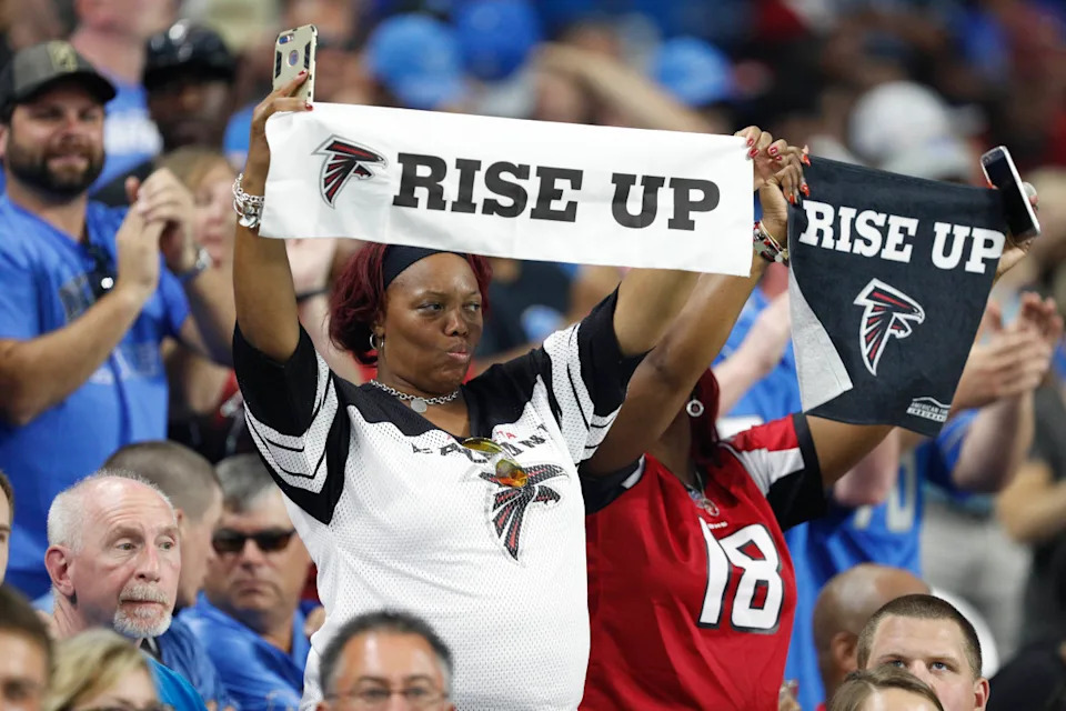 Atlanta Falcons fans hold up Rise Up towels during a game against the Detroit Lions at Ford Field. Raj Mehta-Imagn Images