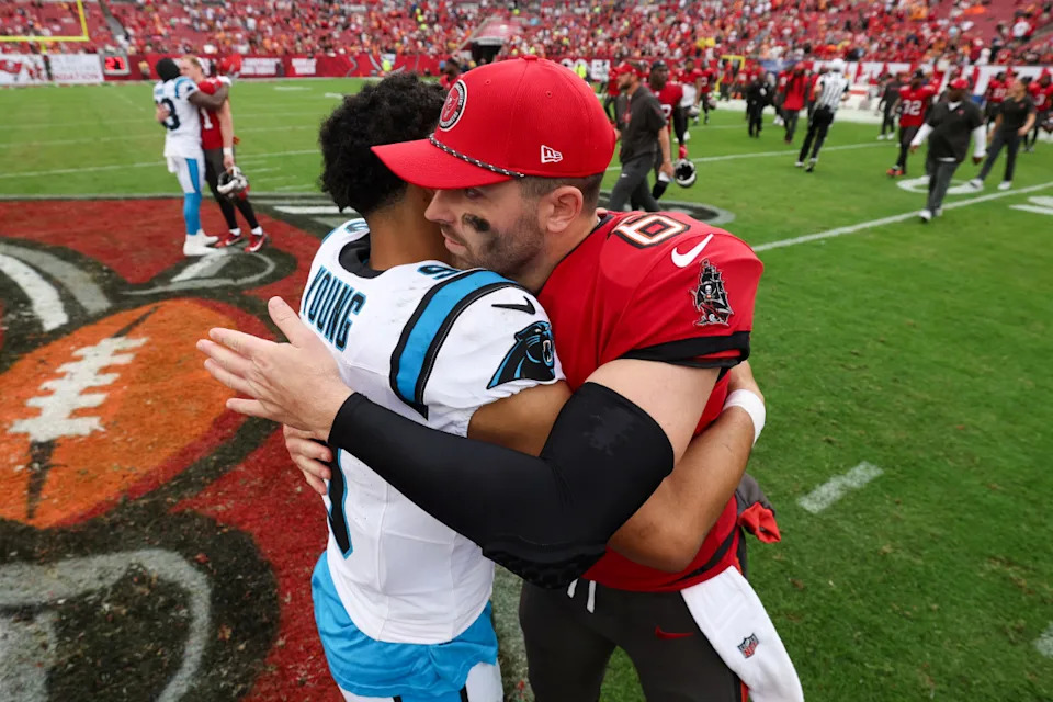 Dec 29, 2024; Tampa, Florida, USA; Tampa Bay Buccaneers quarterback Baker Mayfield (6) great Carolina Panthers quarterback Bryce Young (9) after a game at Raymond James Stadium.© Nathan Ray Seebeck-Imagn Images