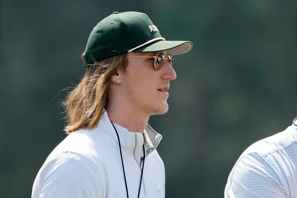 Apr 12, 2025; Augusta, Georgia, USA; Jacksonville Jaguars quarterback Trevor Lawrence walks past no. 10 during the third round of the Masters Tournament at Augusta National Golf Club. Mandatory Credit: Kyle Terada-Imagn Images