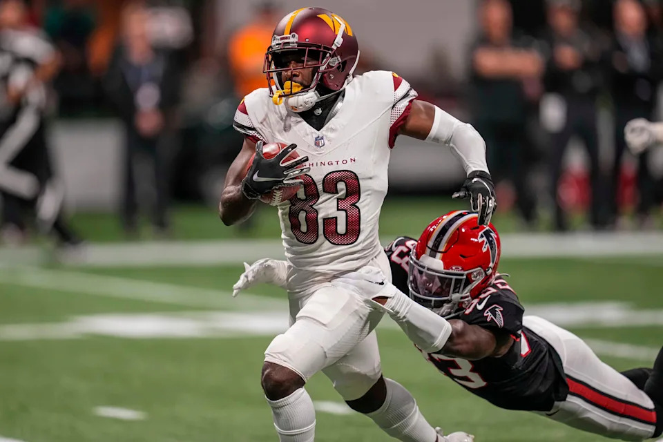 Washington Commanders wide receiver Jamison Crowder (83) is tackled by Atlanta Falcons cornerback Tre Flowers (33) after a long punt return during the first half at Mercedes-Benz Stadium. Mandatory Credit: Dale Zanine-USA TODAY Sports
