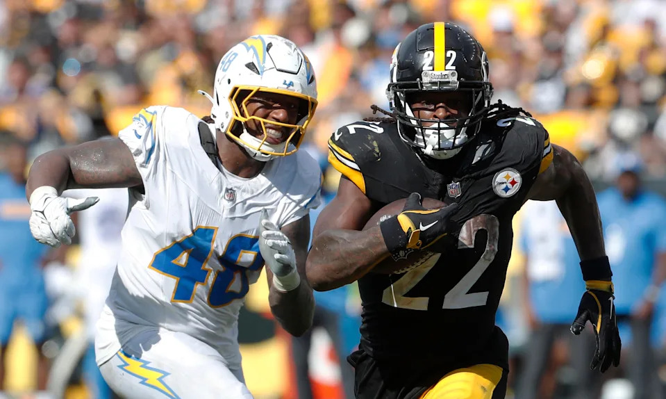 Sep 22, 2024; Pittsburgh, Pennsylvania, USA; Pittsburgh Steelers running back Najee Harris (22) runs the ball as Los Angeles Chargers Los Angeles Chargers linebacker Bud Dupree (48) chases during the fourth quarter at Acrisure Stadium. Pittsburgh won 20-10. Mandatory Credit: Charles LeClaire-Imagn Images