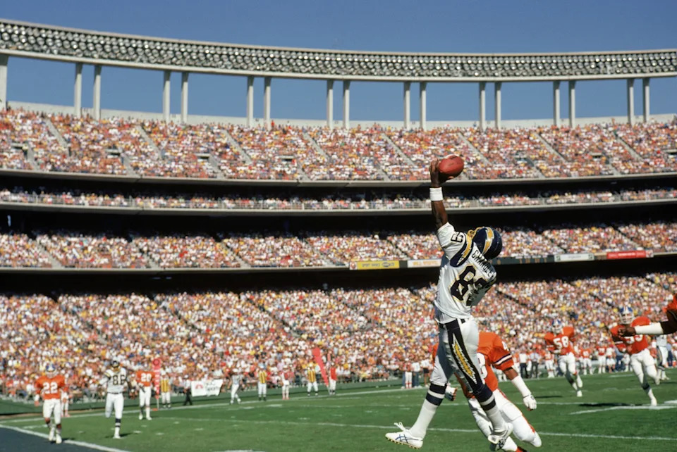 SAN DIEGO Ð 1987: Wide receiver Wes Chandler #89 of the San Diego Chargers reaches for a pass at the endzone during a 1987 NFL game against the Denver Broncos at Jack Murphy Stadium in San Diego, California. (Photo by Stephen Dunn/Getty Images)