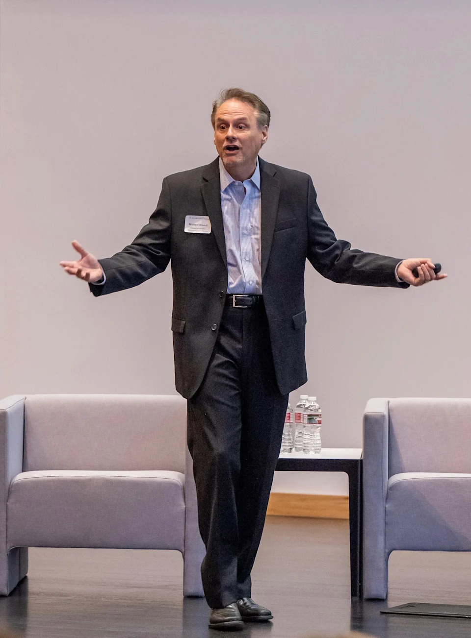 Former University of Texas economics professor Michael Brandl speaks at the McCombs Alumni Conference.