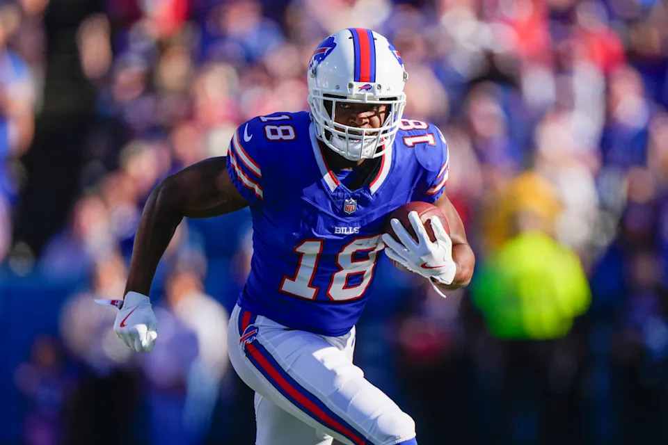 Buffalo Bills wide receiver Amari Cooper (18) runs with the ball after making a catch against the Tennessee Titans during the second half at Highmark Stadium.Gregory Fisher-Imagn Images