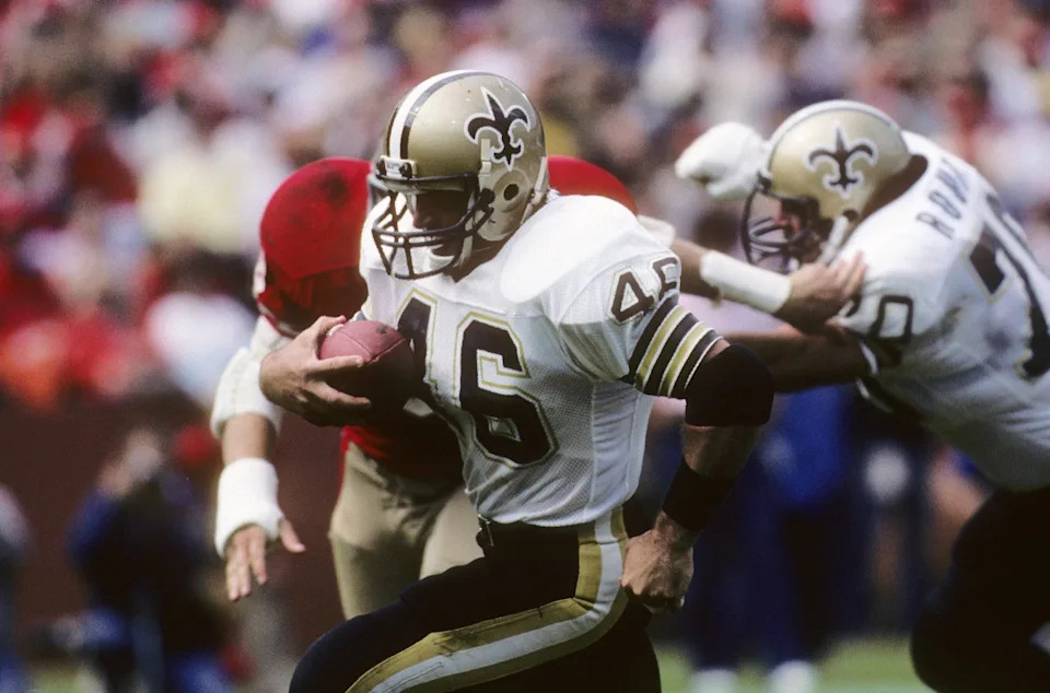 SAN FRANCISCO - SEPTEMBER 29: Running back Hokie Gajan #46 of the New Orleans Saints finds room to run against the San Francisco 49ers defense during a game at Candlestick Park on September 29, 1985 in San Francisco, California. The Saints won 20-17. (Photo by George Rose/Getty Images)
