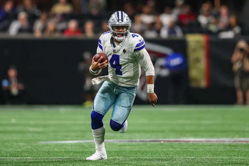 Dallas Cowboys quarterback Dak Prescott (4) scrambles against the Atlanta Falcons in the third quarter at Mercedes-Benz Stadium.Brett Davis-Imagn Images
