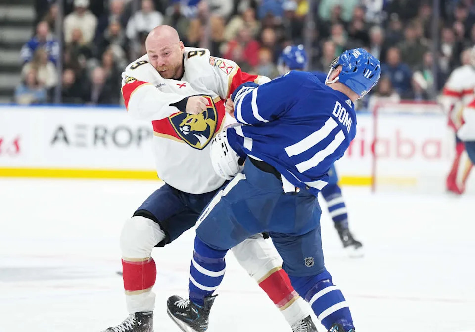 Florida Panthers center Sam Bennett (9) fights with Toronto Maple Leafs center Max Domi (11) during a game at Scotiabank Arena.Nick Turchiaro-Imagn Images