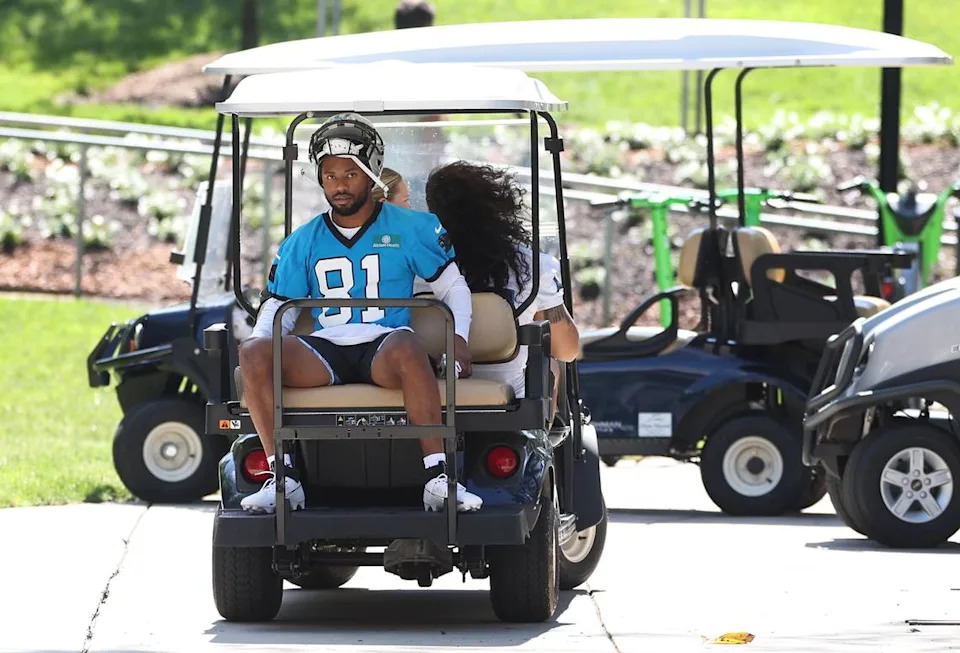 Carolina Panthers rookie wide receiver Moose Muhammad III, center, hops on the back of a golf cart heading to the practice field prior to the team’s rookie minicamp practice on Friday, May 9, 2025.