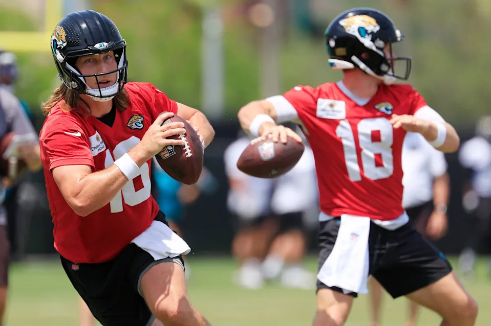 Jacksonville Jaguars quarterback Trevor Lawrence (16) looks to throw next to quarterback John Wolford (18) during the first organized team activity at Miller Electric Center Monday, May 19, 2025 in Jacksonville, Fla.