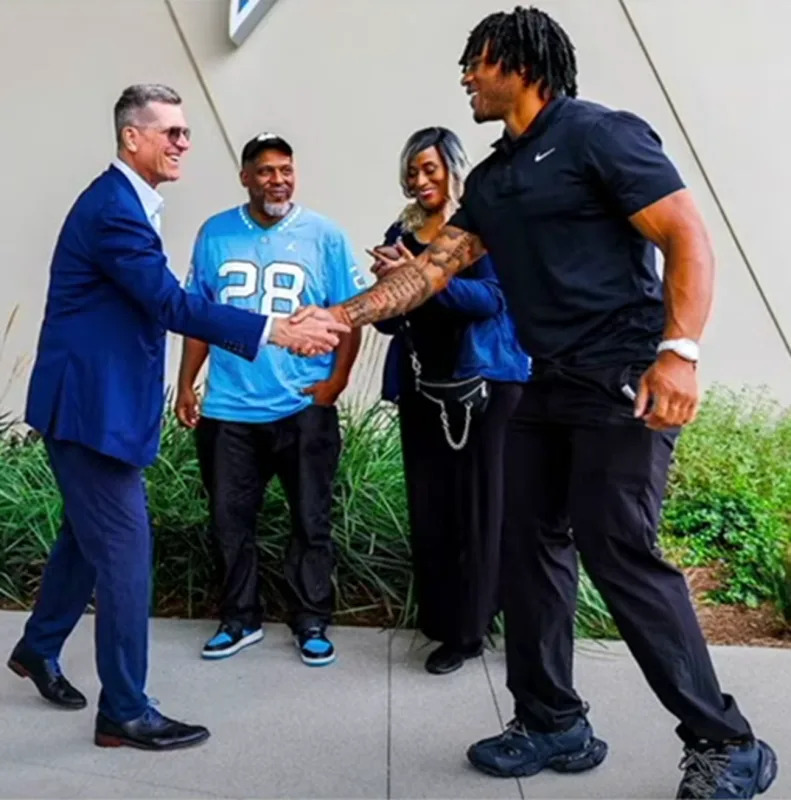 The viral photo of Harbaugh and Hampton. Rich Eisen Show&sol;YouTube