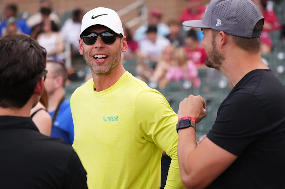 Arizona Cardinals head coach Jonathan Gannon chats on the field before Kyler Murray's celebrity softball game at Salt River Fields in Scottsdale, on May 17, 2025.