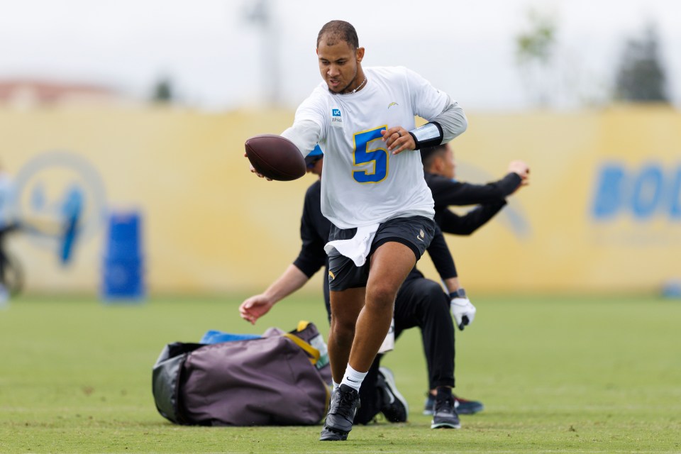 Trey Lance #5 of the Los Angeles Chargers participates in a drill during offseason workouts.