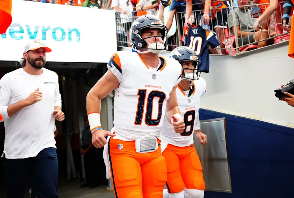 Aug 18, 2024; Denver, Colorado, USA; Denver Broncos quarterback Bo Nix (10) and quarterback Jarrett Stidham (8) before the preseason game against the Green Bay Packers at Empower Field at Mile High. Mandatory Credit: Ron Chenoy-USA TODAY Sports