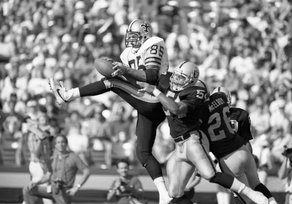 Oct 13, 1985; Los Angeles, CA, USA; FILE PHOTO; New Orleans Saints tight end Hoby Brenner (85) is defended by Los Angeles Raiders linebacker Reggie McKenzie (54) at the Los Angeles Memorial Coliseum. Mandatory Credit: Peter Brouillet-USA TODAY Sports
