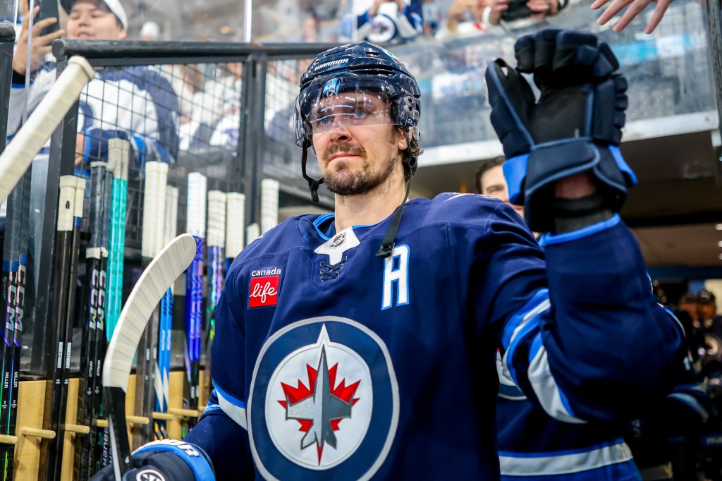 Mark Scheifele #55 of the Winnipeg Jets walks towards the ice