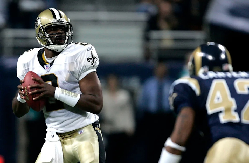 ST. LOUIS - OCTOBER 23: Aaron Brooks #2 of the New Orleans Saints looks to pass against the St. Louis Rams at the Edward Jones Dome on October 23, 2005 in St. Louis, Missouri. The Rams beat the Saints 28-17. (Photo by Dilip Vishwanat/Getty Images)