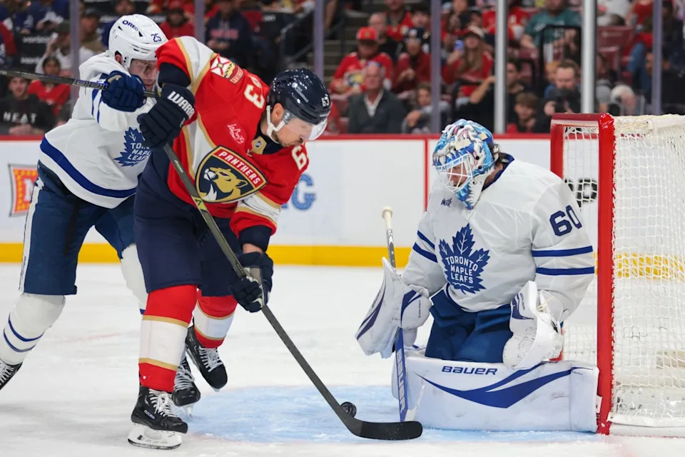 Toronto Maple Leafs goaltender Joseph Woll (60) makes a save against Florida Panthers center Brad Marchand (63) during the second period at Amerant Bank Arena.Sam Navarro-Imagn Images
