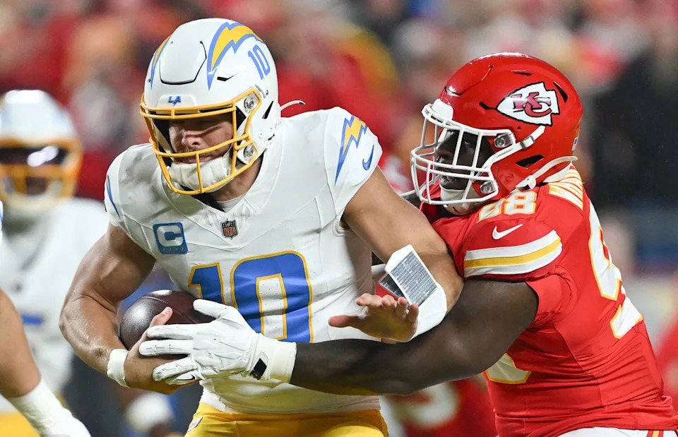 Kansas City Chiefs defensive tackle Tershawn Wharton (98) sacks Los Angeles Chargers quarterback Justin Herbert (10) in a matchup last season. (Tammy Ljungblad/The Kansas City Star/Tribune News Service via Getty Images)