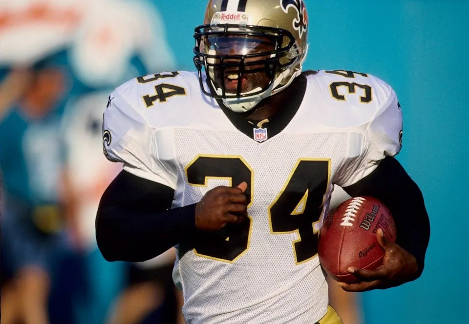 Aug 13, 1999; Miami, FL, USA; FILE PHOTO; New Orleans Saints running back Ricky Williams running the ball against the Miami Dolphins during the 1999 pre-season at Dolphin Stadium. Mandatory Credit: RVR Photos-USA TODAY Sports