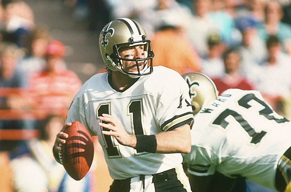 Dec 2, 1984; Anaheim, CA, USA; FILE PHOTO; New Orleans Saints quarterback Richard Todd (11) and Chris Ward (72) in action against the Los Angeles Rams at Anaheim Stadium. Mandatory Credit: Peter Brouillet-USA TODAY NETWORK