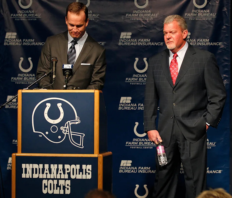Indianapolis Colts owner Jim Irsay, right, tries to hold back tears after he announced that the team is releasing quarterback Peyton Manning after a 14-year run that included one Super Bowl title and four MVP awards, during a news conference, Wednesday, March 7, 2012, in Indianapolis, Indiana. (Sam Riche/Tribune News Service via Getty Images)