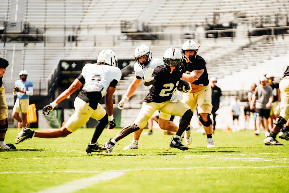 UCF running back Myles Montgomery makes a move in the open field during Saturday's open spring football practice.