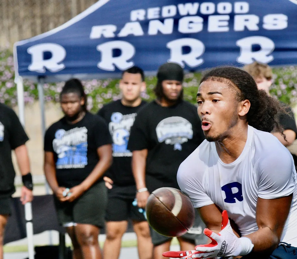 Redwood's Israel Briggs hauls in a pass on May 1, 2025 at the first annual Redwood College Showcase at Mineral King Bowl in Visalia.