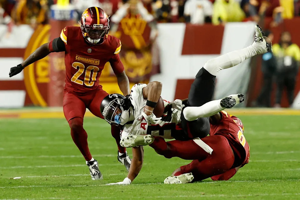 Dec 29, 2024; Landover, Maryland, USA; Atlanta Falcons wide receiver Ray-Ray McCloud III (34) is tackled by Washington Commanders cornerback Mike Sainristil (0) during the fourth quarter at Northwest Stadium. Mandatory Credit: Geoff Burke-Imagn Images