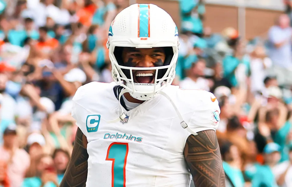 Miami Dolphins quarterback Tua Tagovailoa (1) celebrates after scoring a touchdown against the Arizona Cardinals at Hard Rock Stadium.Sam Navarro-Imagn Images