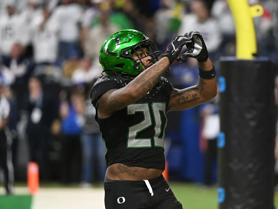 Dec 7, 2024; Indianapolis, IN, USA; Oregon Ducks running back Jordan James (20) reacts after rushing for a touchdown against the Penn State Nittany Lions during the fourth quarter in the 2024 Big Ten Championship game at Lucas Oil Stadium. Mandatory Credit: Robert Goddin-Imagn Images