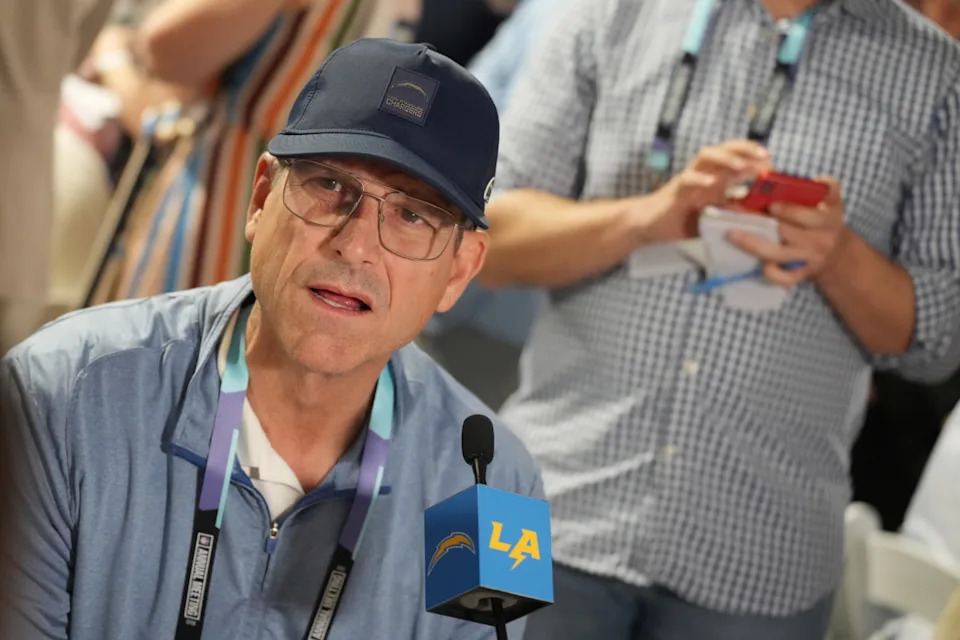 Los Angeles Chargers head coach Jim Harbaugh answers questions during the NFL Annual League Meeting at The Breakers.© Jim Rassol-Imagn Images