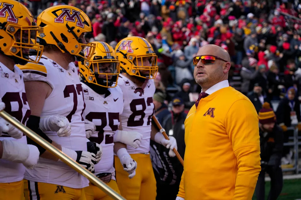 Nov 29, 2024; Madison, Wisconsin, USA; Minnesota Golden Gophers head coach P.J. Fleck looks on before taking the field prior to the game against the Wisconsin Badgers at Camp Randall Stadium. Mandatory Credit: Jeff Hanisch-Imagn Images