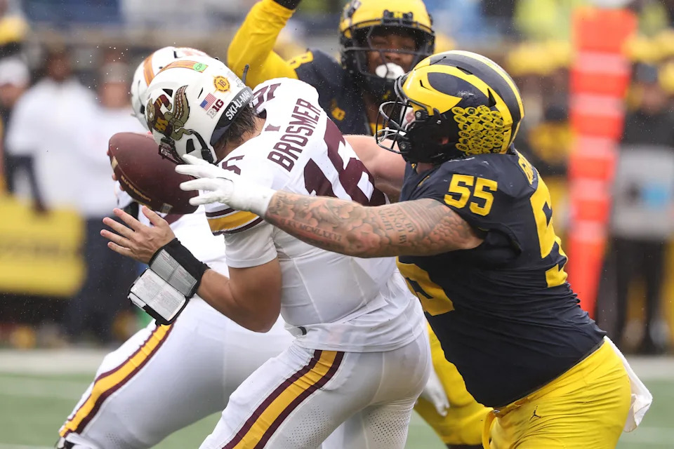 ANN ARBOR, MICHIGAN - SEPTEMBER 28: Max Brosmer #16 of the Minnesota Golden Gophers is sacked in the first half by Mason Graham #55 of the Michigan Wolverines at Michigan Stadium on September 28, 2024 in Ann Arbor, Michigan. (Photo by Gregory Shamus/Getty Images)