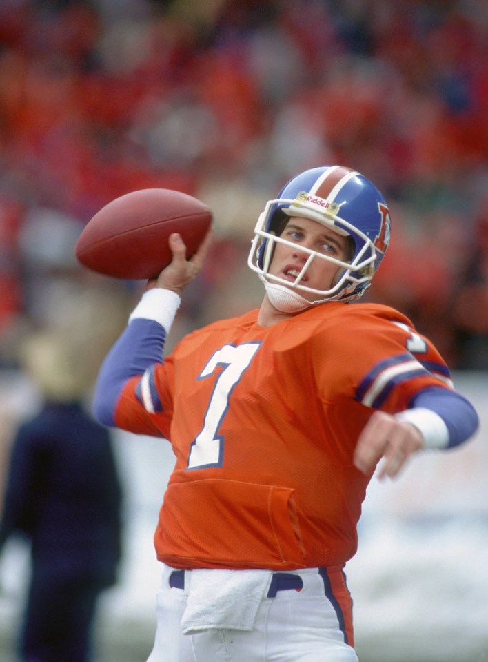 John Elway, Denver Broncos quarterback, throwing a football.