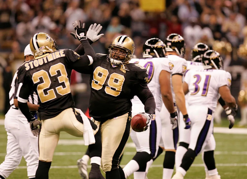 Oct. 29, 2006; New Orleans, LA, USA; New Orleans Saints (99) Hollis Thomas celebrates with (23) Omar Stoutmire after recovering a fumble in the first quarter against the Baltimore Ravens at the Louisiana Superdome in New Orleans, LA. The Ravens defeated the Saints 35-22. Mandatory Credit: Matt Stamey-USA TODAY Sports Copyright Matt Stamey