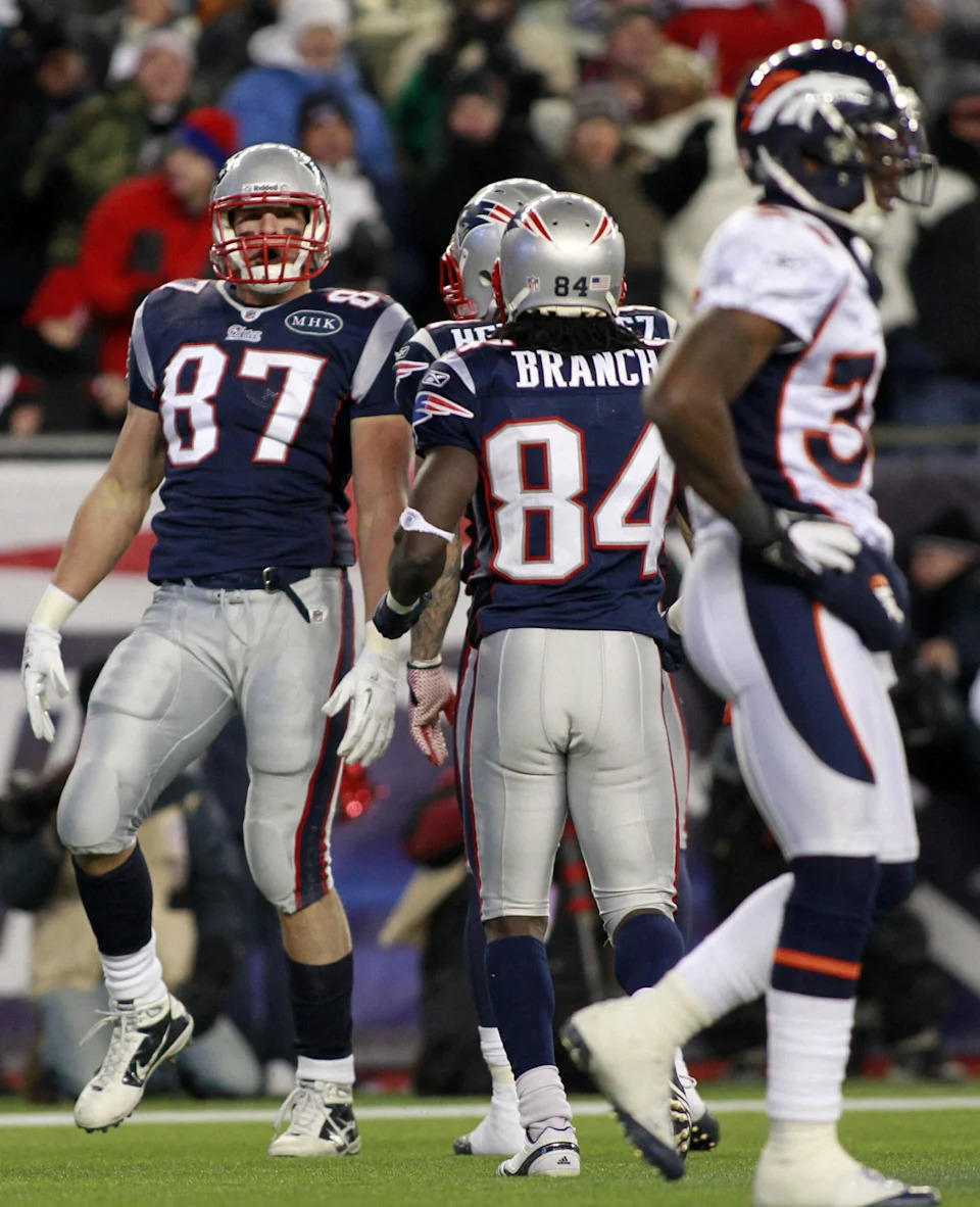 Aaron Hernandez and Rob Gronkowski on the football field.
