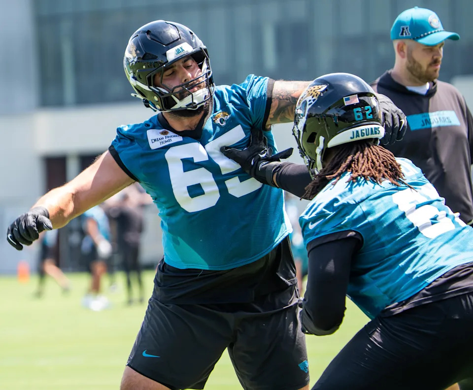 Jacksonville Jaguars guard Patrick Mekari (65) and Jacksonville Jaguars offensive tackle Javon Foster (62) run blocking drills during the fourth organized team activity at the Miller Electric Center on May 27. Doug Engle/Florida Times-Union
