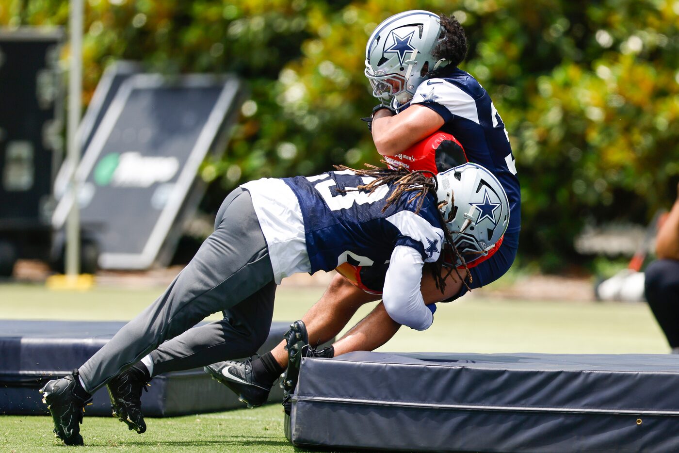 Dallas Cowboys linebacker Buddy Johnson (23) tackles linebacker Marist Liufau (35) during an...