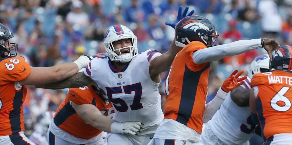 Bills defensive end A.J. Epenesa (57) fights through the Denver line to pressure Broncos quarterback Josh Johnson (11), right, during the Bills preseason game against Denver Saturday, Aug. 20, 2022 at Highmark Stadium. Buffalo won the game 42-15.

Sd 082022 Bills 6 Spts