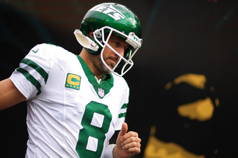 Aaron Rodgers, New York Jets quarterback, wearing his jersey and helmet.