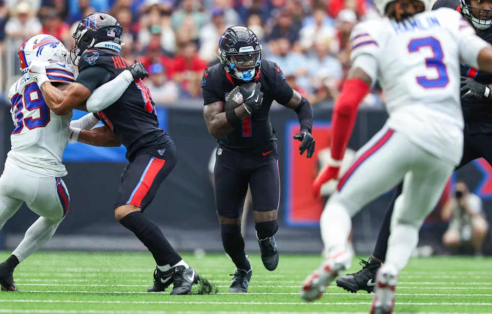 Stefon Diggs runs with the ball after a reception in Nike Kobe 6 'Dark Knight' cleats during the second quarter against the Buffalo Bills at NRG Stadium.Troy Taormina-Imagn Images