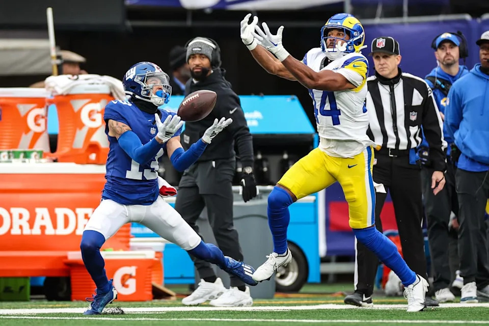 New York Giants wide receiver Jalin Hyatt (13) attempts to catch a pass as Los Angeles Rams cornerback Ahkello Witherspoon (44) defends during the first half at MetLife Stadium