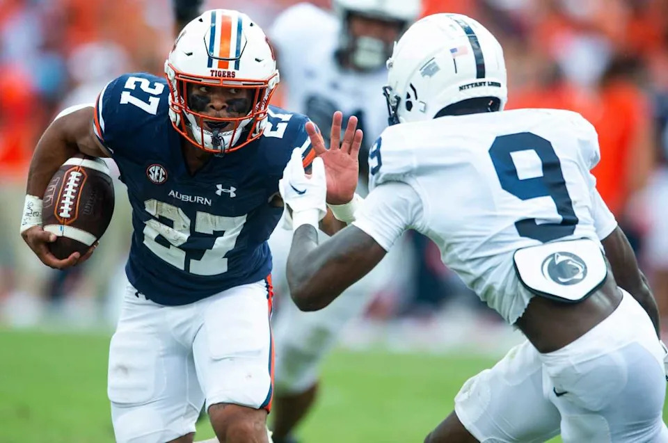 Auburn Tigers running back Jarquez Hunter (27) is defended by Penn State Nittany Lions defensive back Joey Porter Jr. (9) as the Auburn Tigers take on the Penn State Nittany Lions at Jordan-Hare Stadium in Auburn, Ala., on Saturday, Sept. 17, 2022. Jake Crandall &sol; Advertiser &sol; USA TODAY NETWORK