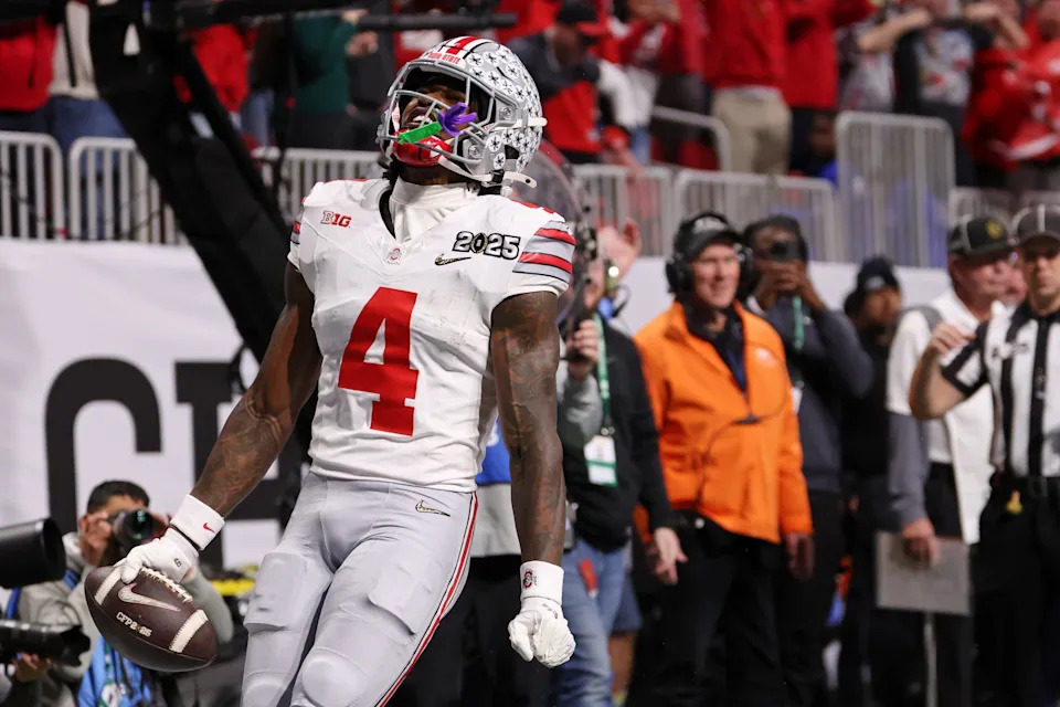 Jan 20, 2025; Atlanta, GA, USA; Ohio State Buckeyes wide receiver Jeremiah Smith (4) reacts after scoring against the Notre Dame Fighting Irish a touchdown during the first half the CFP National Championship college football game at Mercedes-Benz Stadium. Mandatory Credit: Brett Davis-Imagn Images